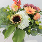 Bouquet de fleurs au choix du fleuriste dans un vase